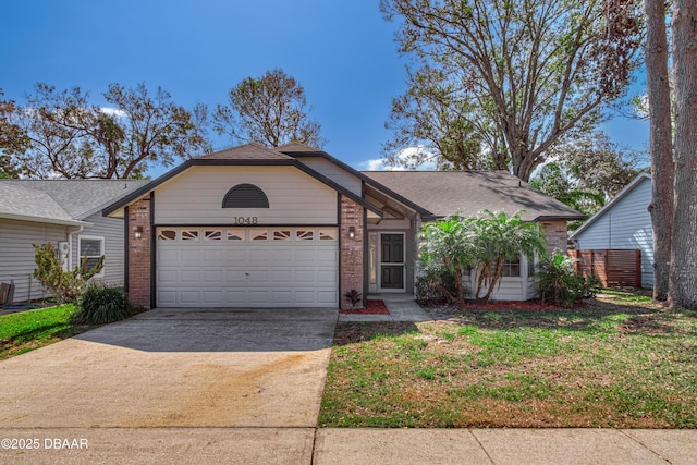 ranch-style house with a garage and a front yard