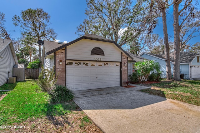 ranch-style home featuring central AC, a garage, and a front lawn