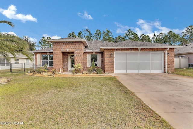 view of front facade featuring a garage and a front lawn