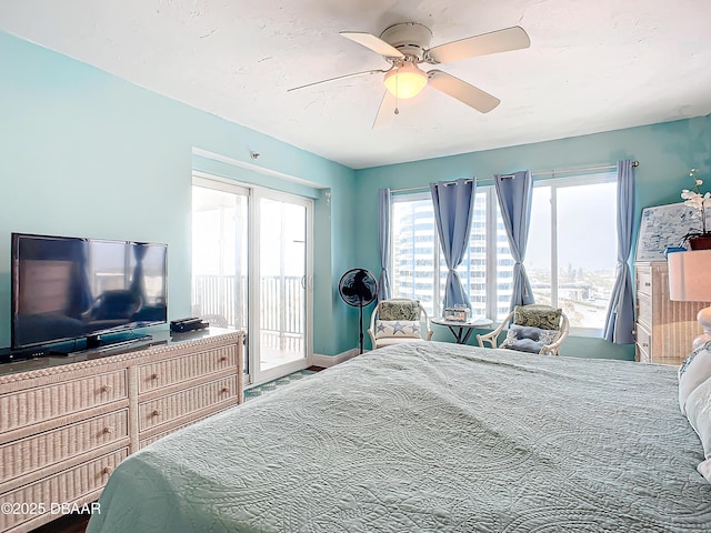 bedroom featuring access to exterior and ceiling fan