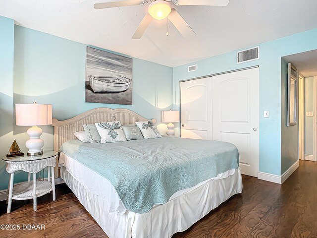 bedroom with ceiling fan, a closet, and dark hardwood / wood-style floors