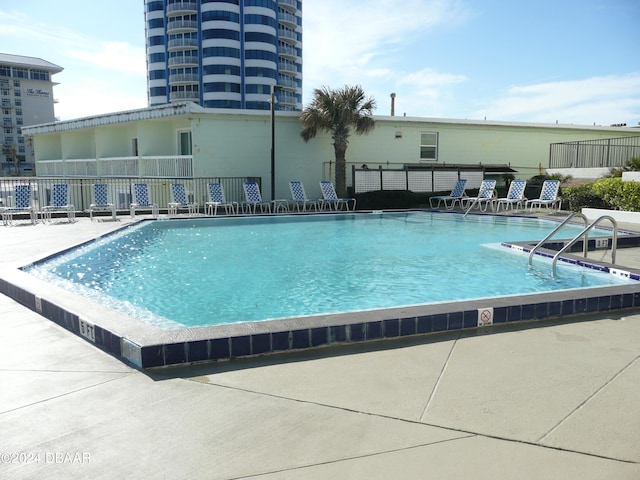 view of pool featuring a patio area