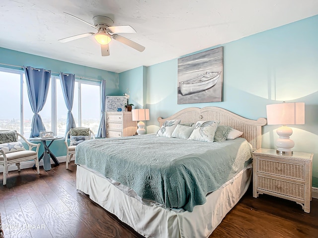 bedroom featuring dark hardwood / wood-style flooring and ceiling fan