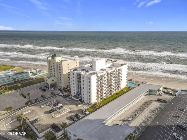 bird's eye view featuring a beach view and a water view