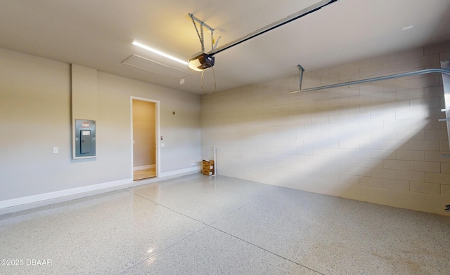 garage featuring a garage door opener and electric panel