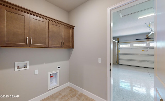 washroom featuring electric dryer hookup, washer hookup, and cabinets