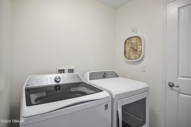 clothes washing area featuring washing machine and dryer