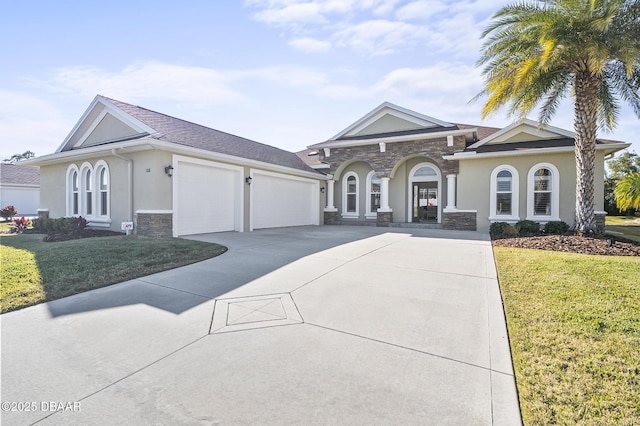 view of front of home with a garage and a front lawn