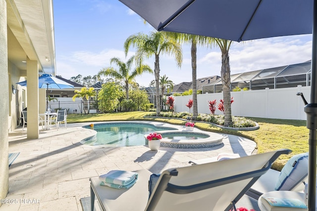 view of swimming pool with a patio area and an in ground hot tub