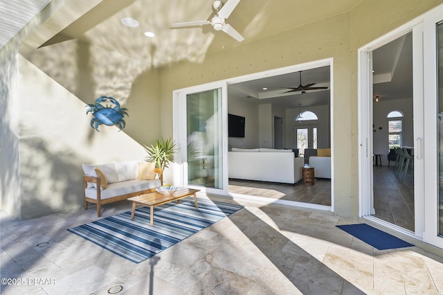 view of patio / terrace featuring ceiling fan and an outdoor living space