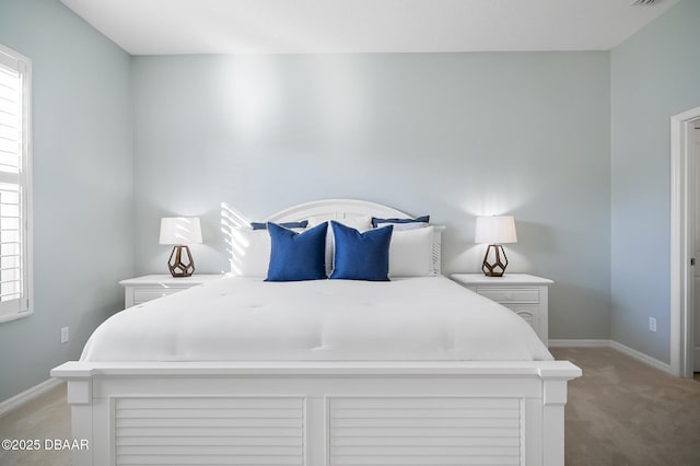 bedroom featuring light colored carpet