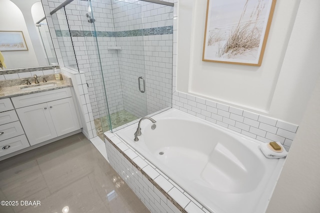 bathroom featuring vanity and plus walk in shower