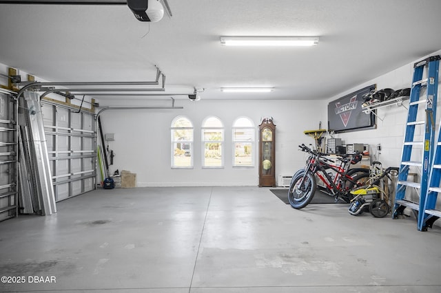 garage featuring a garage door opener