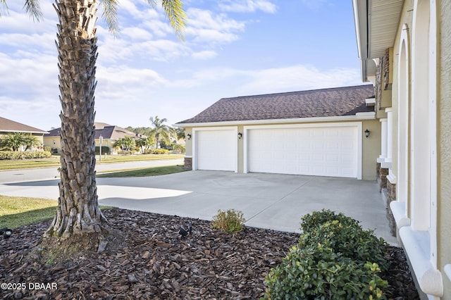 view of side of home featuring a garage