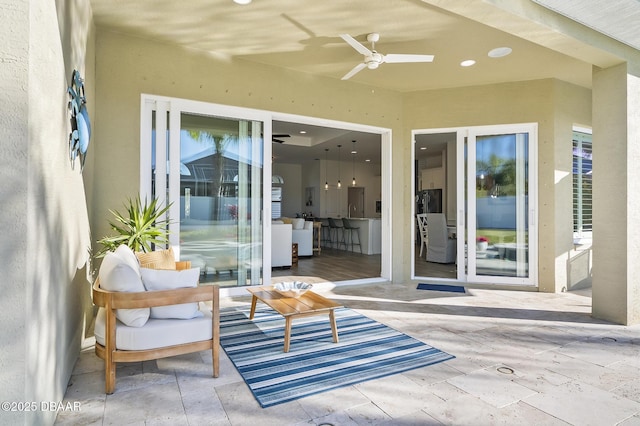 view of patio featuring ceiling fan