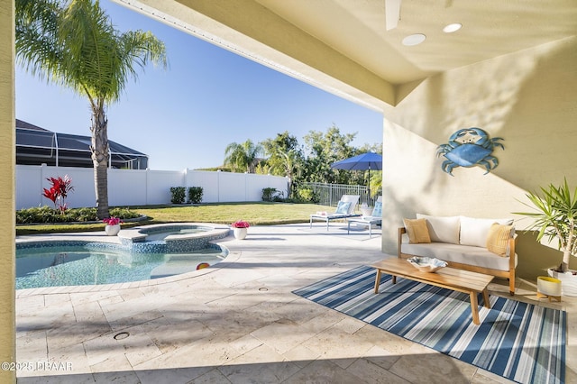 view of pool with an in ground hot tub and a patio