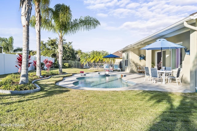 view of pool with a yard and a patio