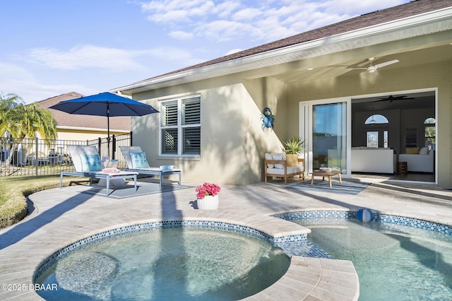 view of swimming pool with a patio area, a hot tub, and ceiling fan