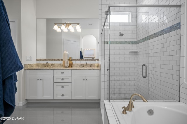 bathroom with vanity and independent shower and bath