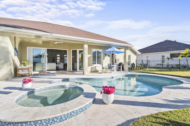 view of pool featuring an in ground hot tub and a patio