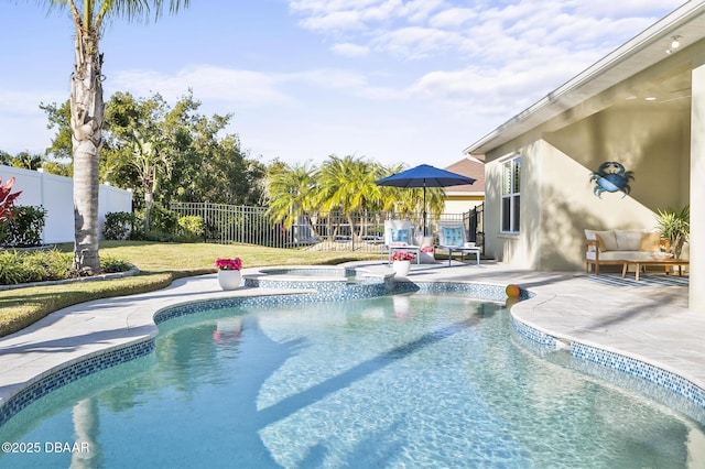 view of swimming pool with an in ground hot tub and a patio