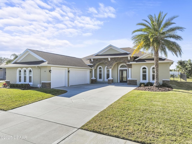 ranch-style house featuring a garage and a front yard