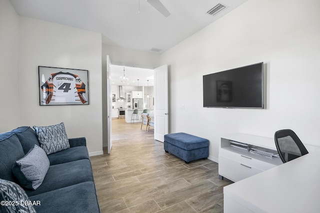 living room with ceiling fan