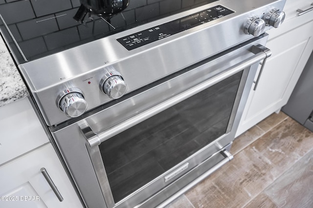 details with white cabinetry and stove