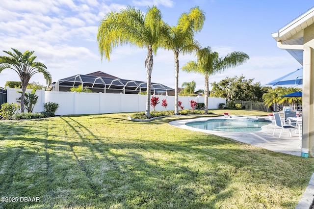 view of yard featuring a fenced in pool and a patio