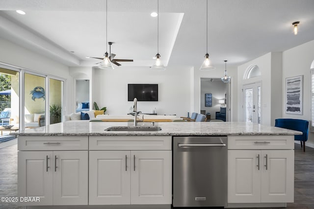 kitchen featuring white cabinetry, sink, and light stone countertops