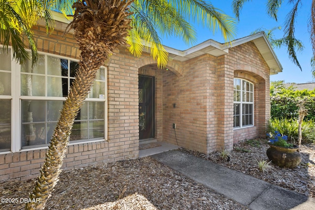 property entrance with brick siding