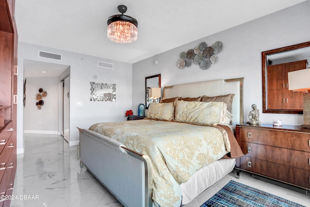 bedroom with a chandelier