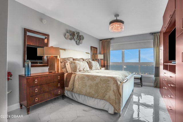 bedroom featuring a chandelier