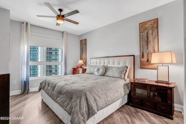 bedroom featuring hardwood / wood-style flooring and ceiling fan