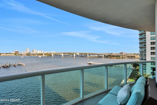 balcony featuring a water view