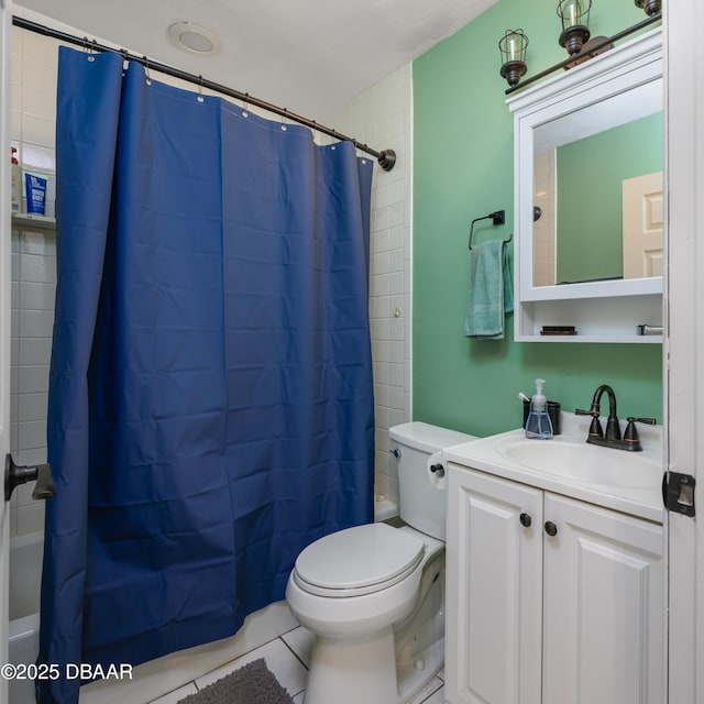1635 Magnolia Ave, South Daytona, FL 32119 - full bath with shower / bath combination with curtain, tile patterned floors, vanity, and toilet