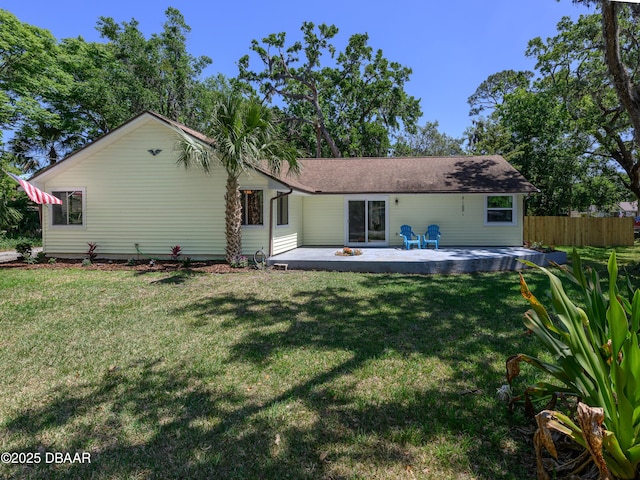 1635 Magnolia Ave, South Daytona, FL 32119 - back of property featuring a patio, a yard, and fence