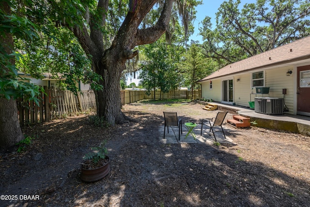 1635 Magnolia Ave, South Daytona, FL 32119 - view of yard featuring central air condition unit, a patio, and a fenced backyard