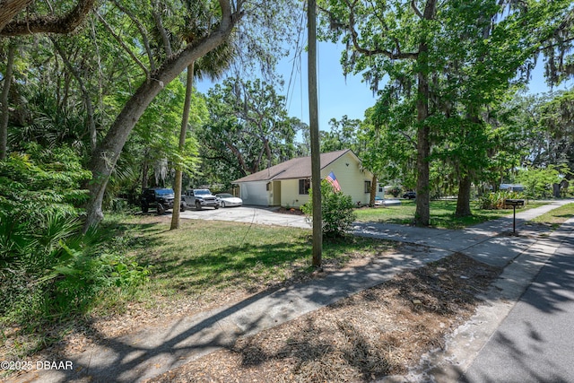 1635 Magnolia Ave, South Daytona, FL 32119 - view of property exterior with a lawn