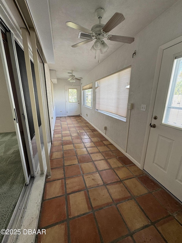 unfurnished sunroom with a wealth of natural light