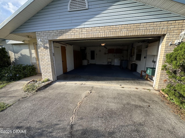 garage featuring driveway