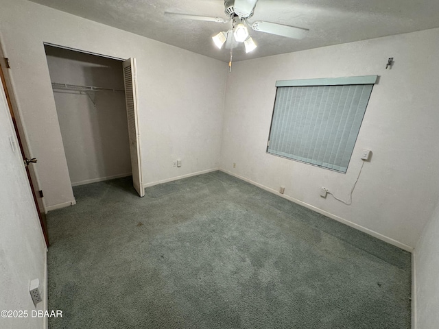 unfurnished bedroom with a textured ceiling, a closet, baseboards, and carpet flooring