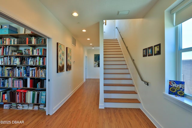 staircase featuring hardwood / wood-style flooring