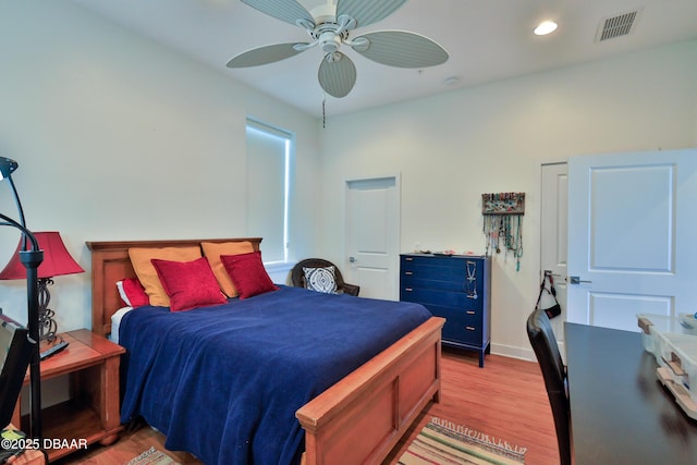 bedroom featuring ceiling fan and light hardwood / wood-style floors