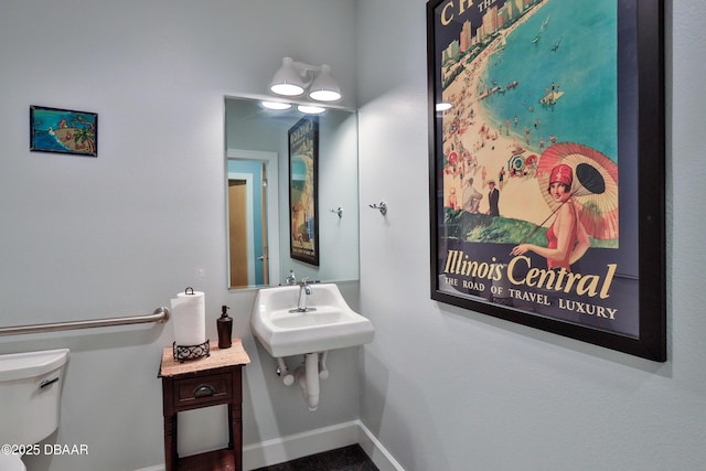 bathroom with sink and toilet