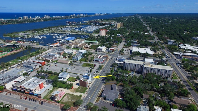 birds eye view of property with a water view