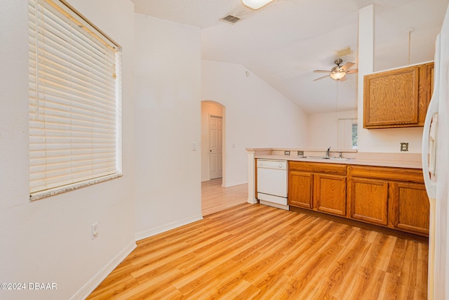 kitchen with ceiling fan, sink, lofted ceiling, white appliances, and light wood-type flooring