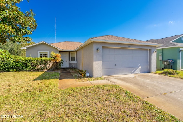 ranch-style home with a garage and a front yard