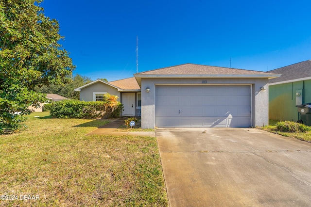 ranch-style home with a garage and a front yard