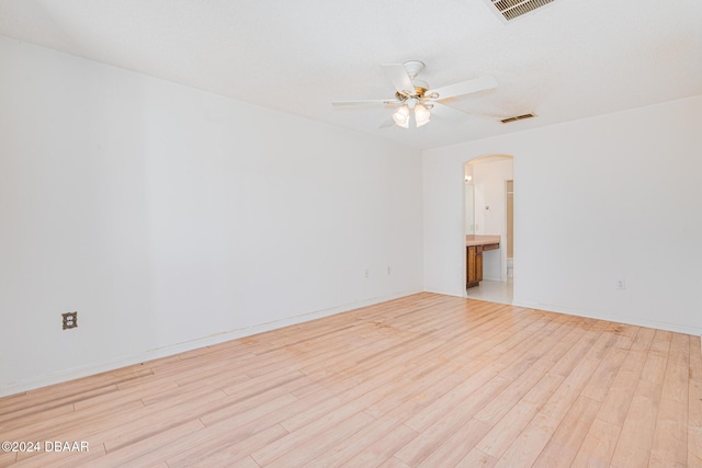 spare room with ceiling fan and light hardwood / wood-style floors